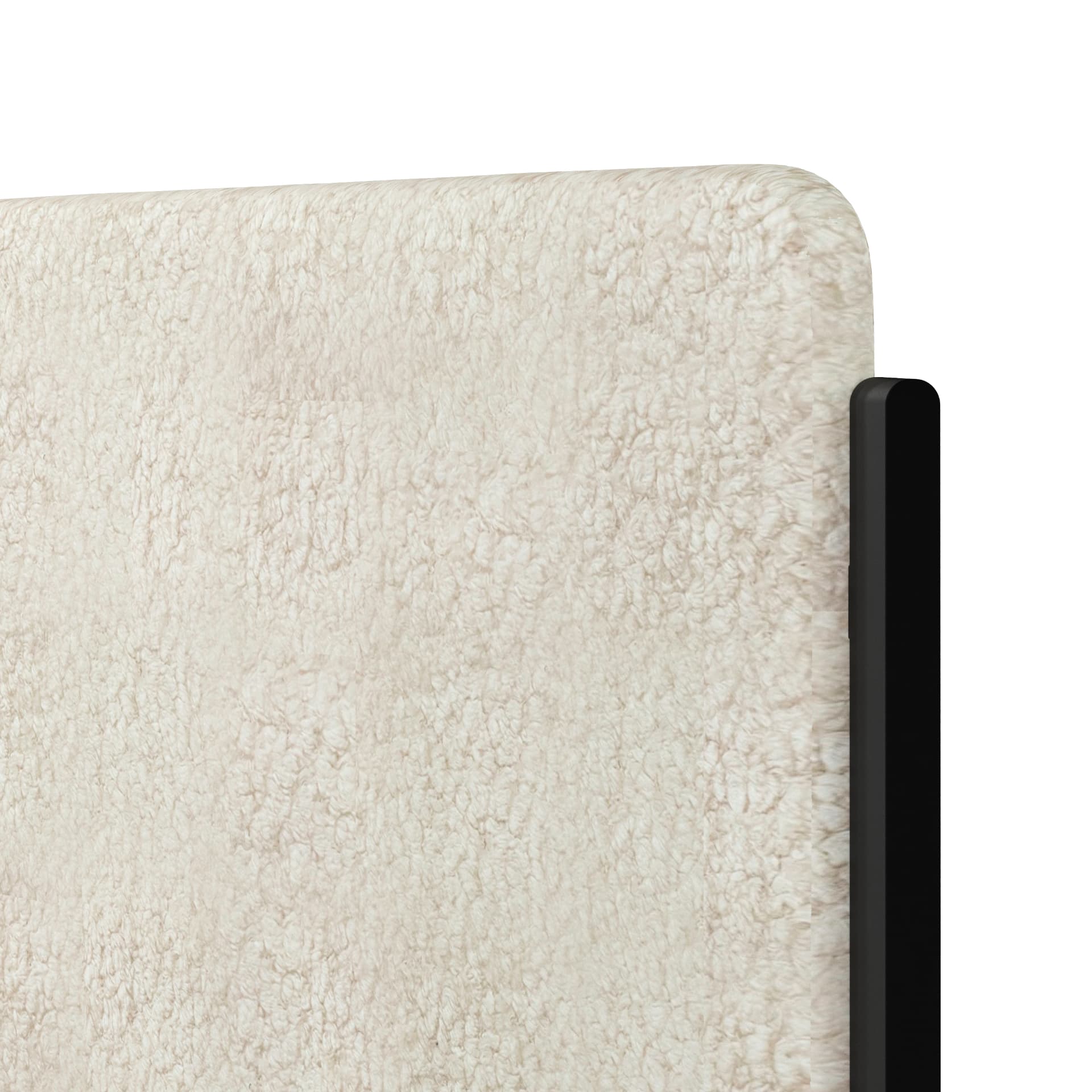 Close-up of Noa Onyx frame with Highland Fleece bouclé upholstery